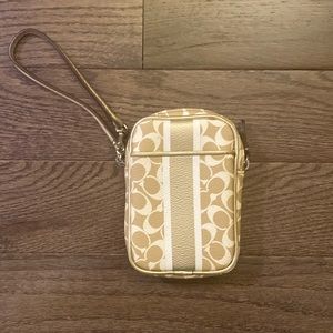 Coach - Tan & white wristlet with metallic trim